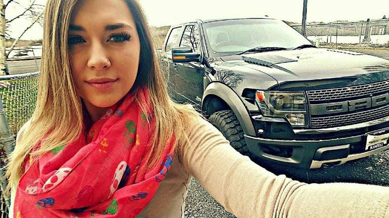 Bailey Jasper of Moses Lake, Wash., with her new Ford F-150 SVT Raptor that replaced her totaled vehicle.