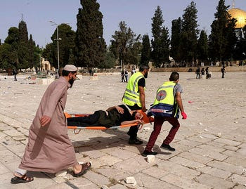 Palestinian wounded on the Al-Aqsa compound after clashes with Israeli security forces, May 2021.
