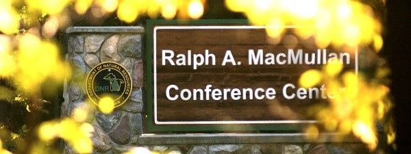 RAM center sign framed with yellow leaves
