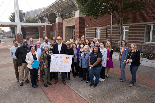 Gov. Jay Inslee and staff from MultiCare and Mount Tahoma High School pose for a picture outside the new school-based health center.