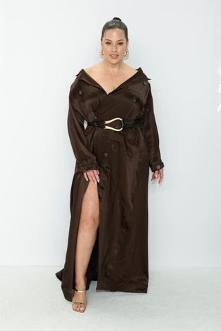 Image may contain Fashion Ashley Graham Dress Clothing Adult Person Coat Robe Footwear Sandal and Belt