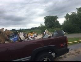 pick-up truck filled with debris