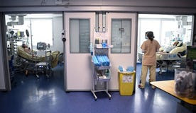 Medical staff members tend to patients in the COVID intensive care unit in Paris, France.