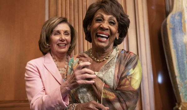 In this file photo, House Speaker Nancy Pelosi of Calif., left, and Rep. Maxine Waters, D-Calif., laugh after Waters told Pelosi a funny story, after Pelosi signed bill enrollments for Congressional Review Act Resolutions S. J. Res. 13, 14 and 15, Tuesday, June 29, 2021, on Capitol Hill in Washington. (AP Photo/Jacquelyn Martin) **FILE**