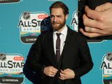 Washington Capitals goaltender Braden Holtby has his ring finger (inset) tattooed with two lines to represent a wedding band. &quot;It&#39;s something that shows another sign of commitment,&quot; Holtby said. Wedding ring tattoos is a trend growing popular among hockey players and non-athletes alike.