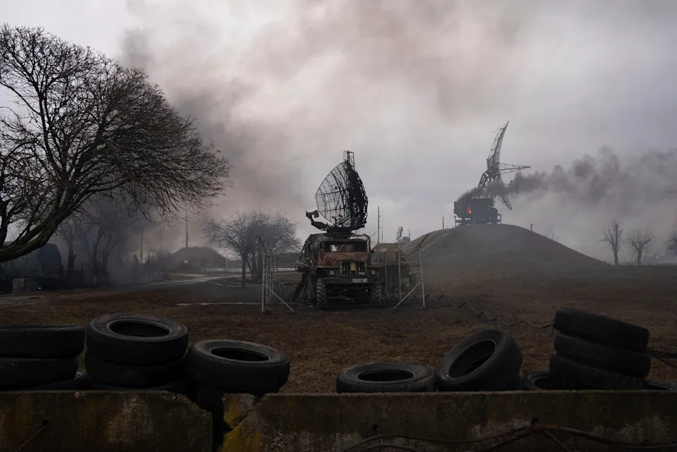 Smoke rises from an air defense base in the aftermath of a strike.