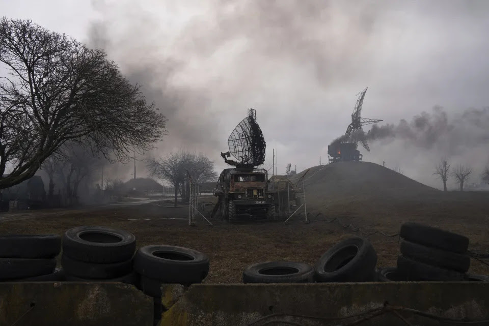 Smoke rises from an air defense base in the aftermath of a strike.