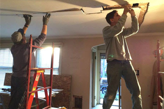 Joe working on remodeling house