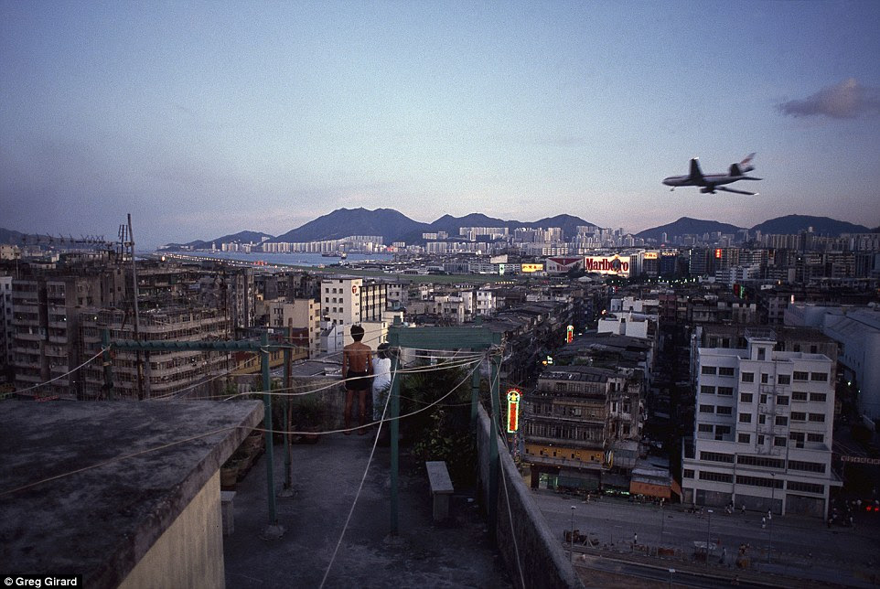 Photographer Greg Girard captured jaw-dropping images of daily life within the six-acre site, including children playing on rooftops