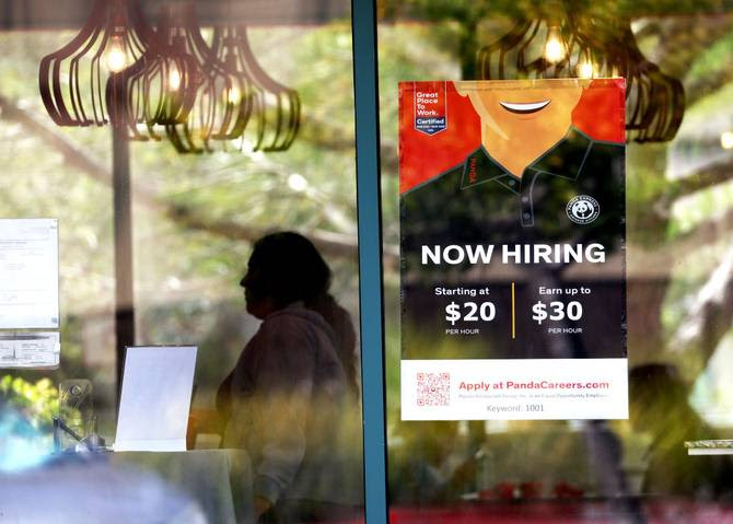 A now hiring sign is posted at a Panda Express restaurant on August 05, 2022 in Marin City, California.