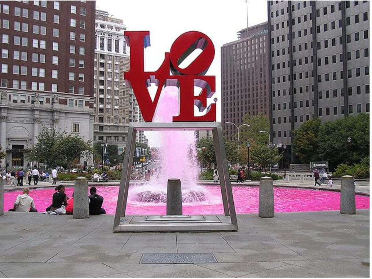Located in Love Plaza, Philadelphia, PA. The water behind the sculpture was turned pink for breast cancer awareness month (October).
