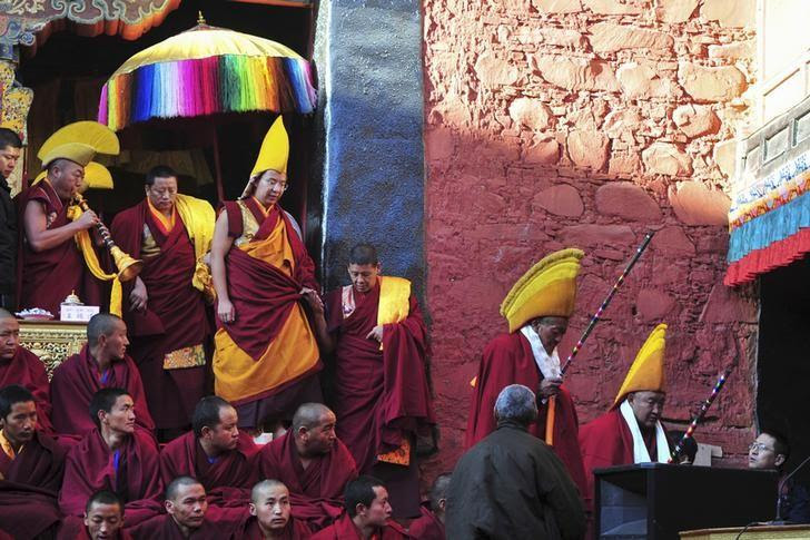 Gyaltsen Norbu (top 4th L), the 11th Panchen Lama, arrives at a Buddhism gathering at the Tashilhunpo Monastery in Shigatse, Tibet Autonomous Region, China, December 8, 2015. Picture taken December 8, 2015. REUTERS/China Daily/File Photo