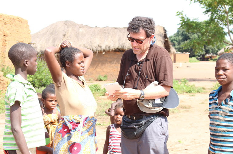 Speaking with villagers in a remote part of northern Angola.