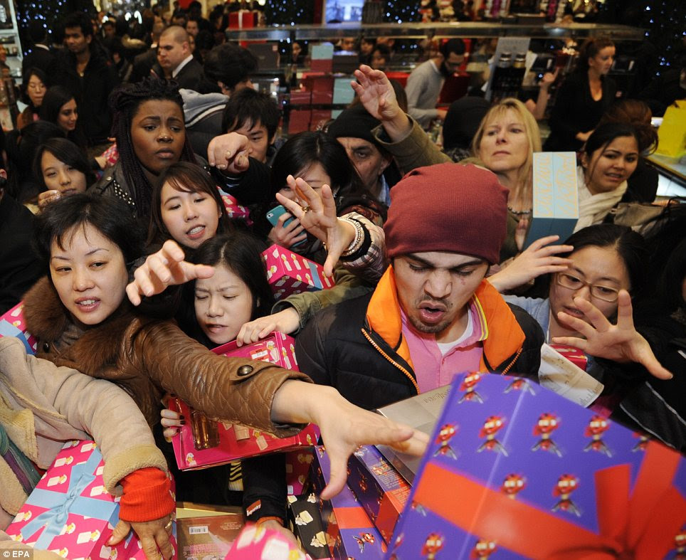 Carnage: Many foreign tourists were among the bargain-hunters who squeezed into Selfridges on Oxford Street today