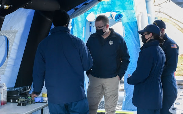  Members of the Coast Guard National Strike Force Atlantic Strike Team show Acting Homeland Security Secretary Peter Gaynor a decontamination station for Coast Guard security operations for the 2021 Presidential Inauguration at Joint Base Anacostia-Bolling, Washington, Jan. 16, 2021. On Sept. 24, 2018, the Department of Homeland Security designated the Presidential Inauguration as a recurring National Special Security Event. Events may be designated NSSEs when they warrant the full protection, incident management and counterterrorism capabilities of the Federal Government. (U.S. Coast Guard photo by Petty Officer 3rd Class Kimberly Reaves/Released) 