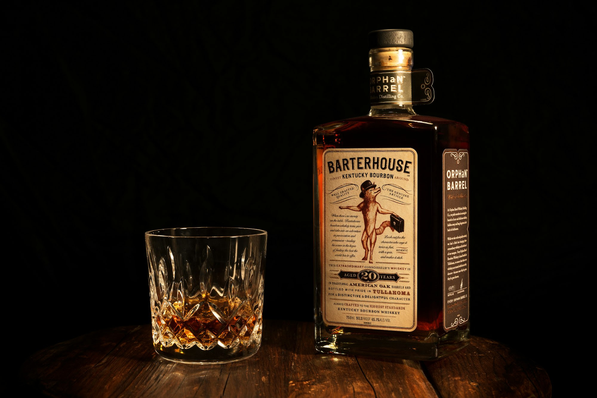 Personal work; product shot of a bottle of Orphan Barrel Barterhouse bourbon and a Waterford Crystal tumbler.