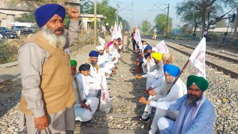 Farmers under the banner of Kisan Mazdoor Sangarsh Samiti squatting on a railway track at Vallah in Punjab's Amritsar on the call given for 'Bharat Bandh' against Centre's farm laws.