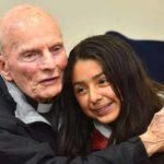 The Rev. Richard Brown hugs Anahi Balladares, 12, at the farewell dinner for him.