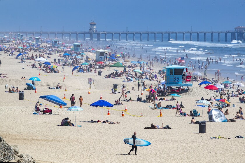 Those flocking to the beach see little risk of getting coronavirus. Experts aren’t so sure