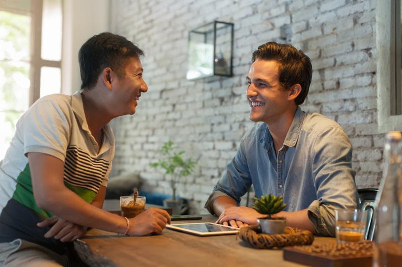 Two Men Sitting at Cafe, Asian Mix Race Friends Guys Happy Smile Natural Light     Note  Visible grain at 100 , best at smaller sizes