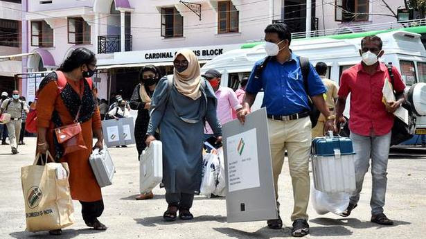  Polling officials leave for their respective polling stations at St. Mary’s School in Thiruvananthapuram on April 5, 2021. 