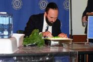 Rabbi checks for bugs in vegetables.