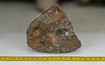 K-feldspar altered megacrystic syenite with chalcopyrite mineralization found in outcrop at “Rock Island II”, a new showing ~470 metres NE of Burgundy Ridge exposed by rapidly receding glaciers. (CNW Group/Crystal Lake Mining Corporation)