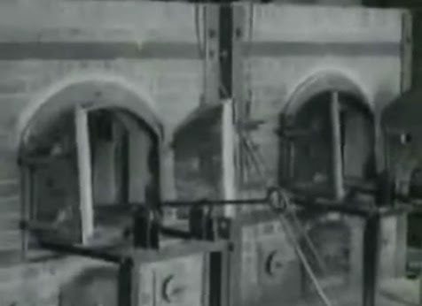 This                 crematory is shown in the film to be in Dachau, with                 single muffle furnaces (35min. 20sec.)