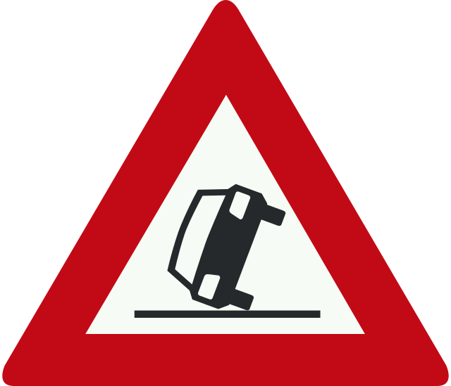 A red triangle sign with a black and white image of a car fallingDescription automatically generated with low confidence