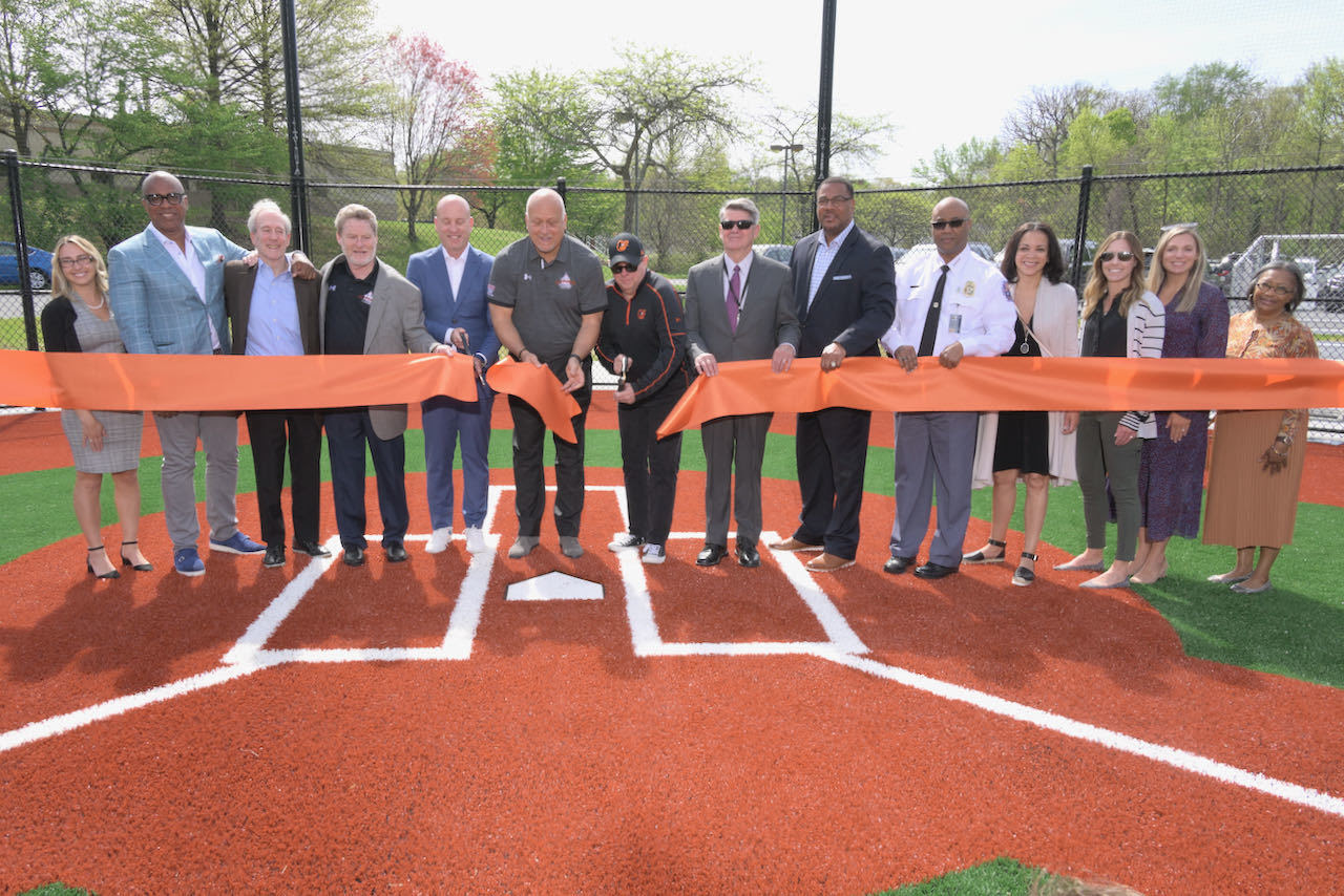 Governor Hogan and Cal Ripken Jr. cut ribbon on New Youth Development Park at Prince George's County Police Department.