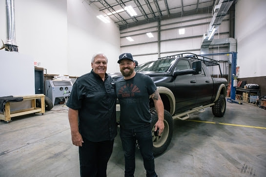 Rick Hendrick and Zac Brown in front of the Ram 2500 Commando being auctioned off for Camp Southern Ground 