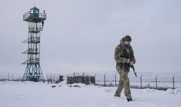 A Ukrainian border guard patrols the border with Russia not far from Hoptivka village, Kharkiv region, Ukraine, Wednesday, Feb. 2, 2022. Russian President Vladimir Putin is accusing the U.S. and its allies of ignoring Russia&#39;s top security demands but says Moscow is willing to talk more to ease tensions over Ukraine. (AP Photo/Evgeniy Maloletka)