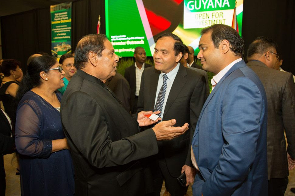 Prime Minister Moses Nagamootoo (left) in conversation with some of the attendees. (DPI photo)