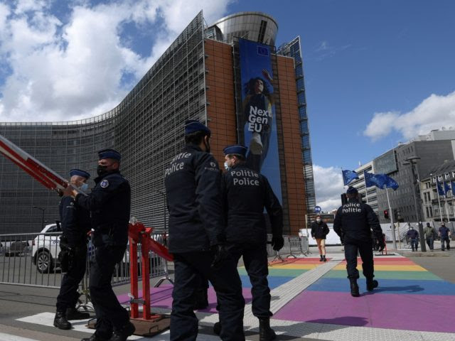 Police officers stand guard in front of the European Union Commission and Europa Consilium buildings during a European Summit in Brussels on May 24, 2021. (Photo by JOHN THYS / AFP) (Photo by JOHN THYS/AFP via Getty Images)