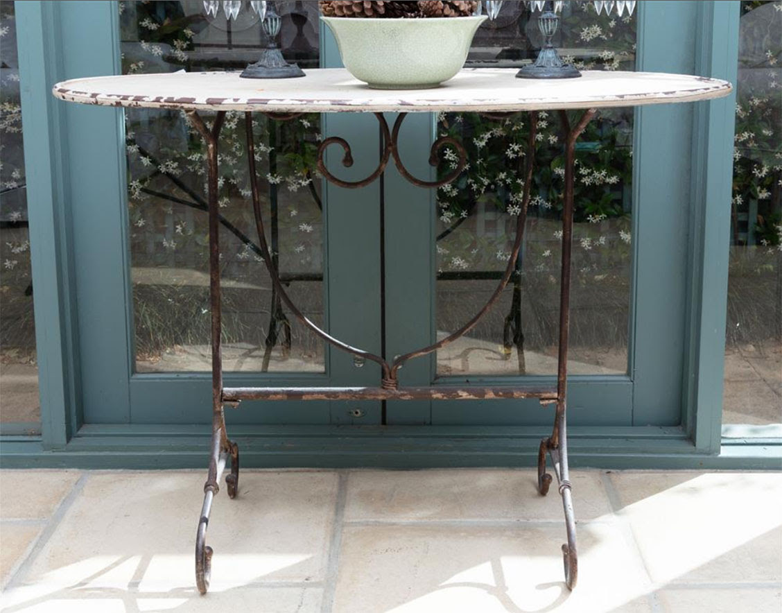 Lot 6. An antique French style oval top patio table
