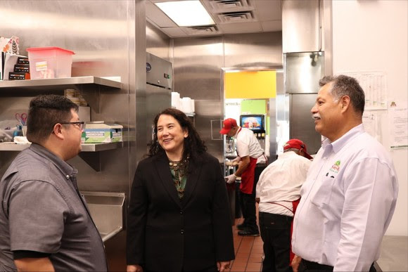 Photo of Administrator Guzman with employees at Don Tortaco