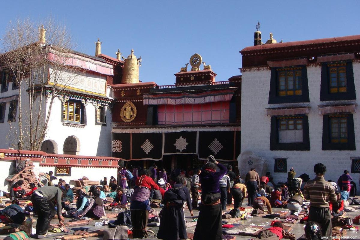 Buddhist devotees prostrate outside Jokhang temple in Lhasa in an undated file photo. The Jokhang Temple located in Barkhor Square at the center of Lhasa. It was the first Buddhist temple in Tibet.