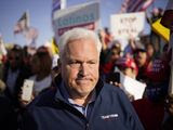Matt Schlapp, chairman of the American Conservative Union, leaves after speaking at a news conference outside of the Clark County Election Department, Sunday, Nov. 8, 2020, in North Las Vegas. (AP Photo/John Locher)