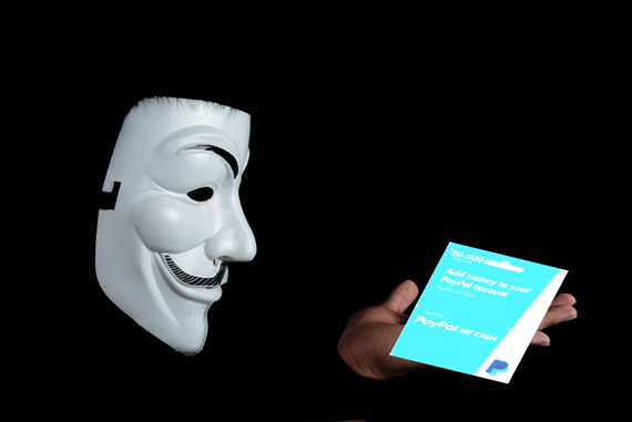 a person holding a card and a mask