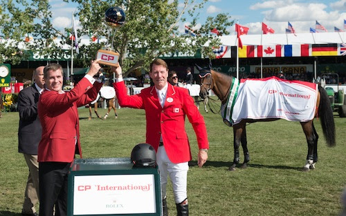 Ian Millar raises his winning trophy with Keith Creel, President & Chief Operating Officer, CP.