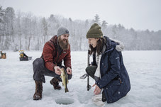 two people ice fishing