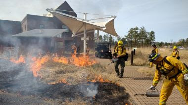 Rangers maintaining the prescribed fire