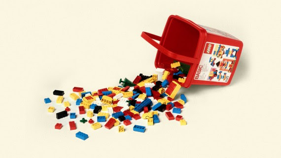 A photo-illustration of a bucket of spilled Lego bricks.