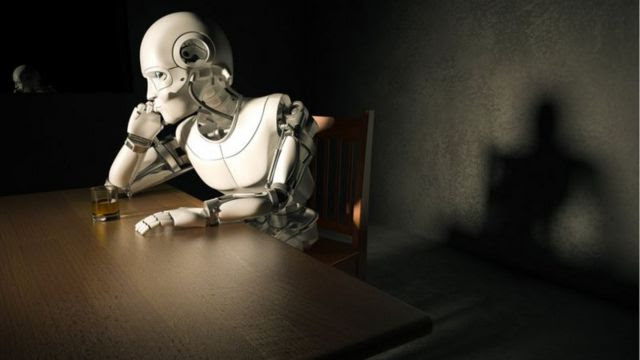 robô sentado na mesa