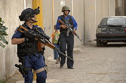 Iraqi police officer with Tabuk sniper rifle.jpg