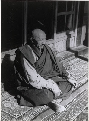 Khenchung Lobsang Jungme seated on a carpet