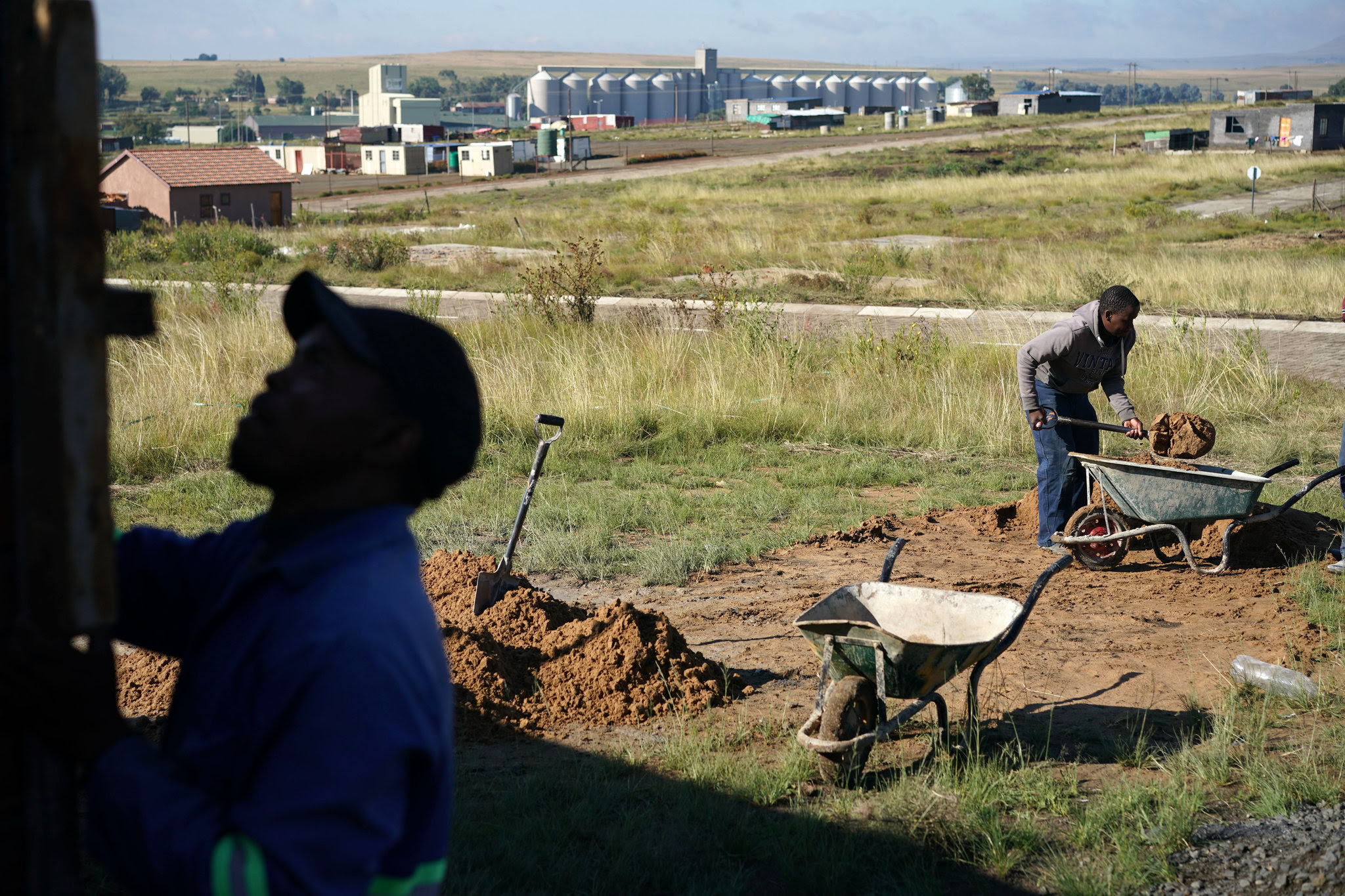 Workers building a house in Thembalihle, a township that borders Vrede in Free State. In many townships in South Africa, the level of local corruption can be quickly gauged by the quality of government housing for the poor. Credit Joao Silva/The New York Times 