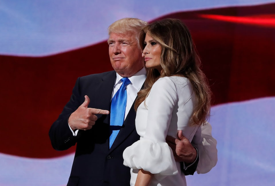Republican presidential candidate Donald Trump, right, stands with his wife Melania on stage after introducing her during the Republican National Convention, Monday, July 18, 2016, in Cleveland. (AP Photo/Carolyn Kaster)