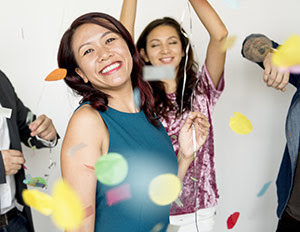 women celebrating with confetti