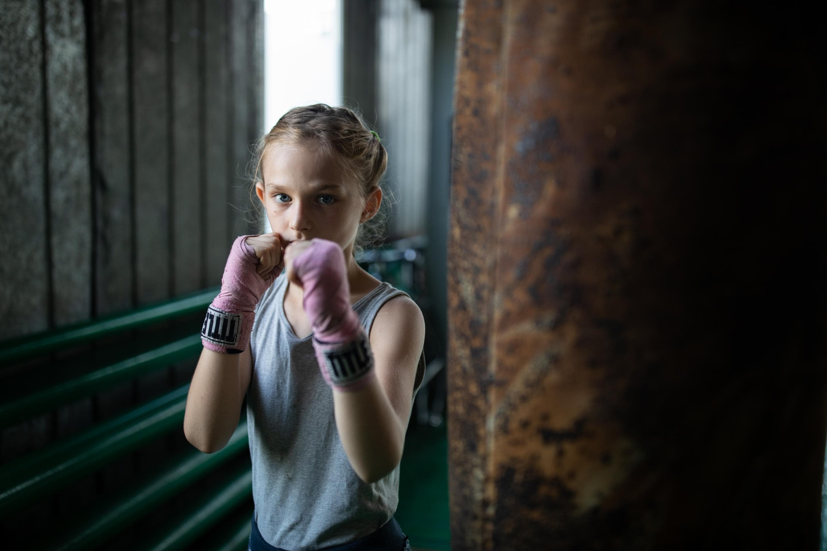 Margot, 10, warms up before her fight at the Jaguar Boxing Club of Odesa